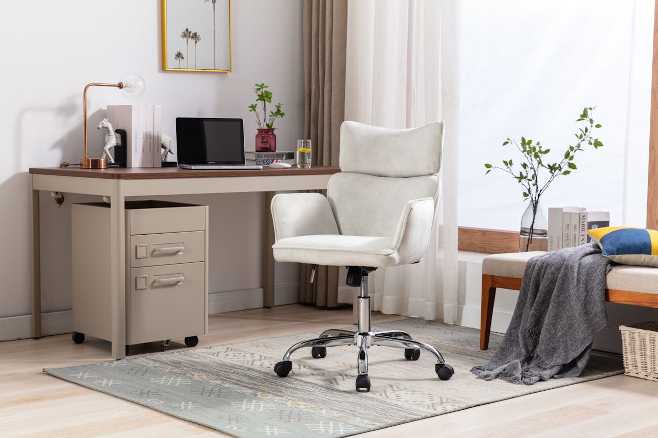 Bright minimalist office interior featuring a stylish swivel chair and desk setup.